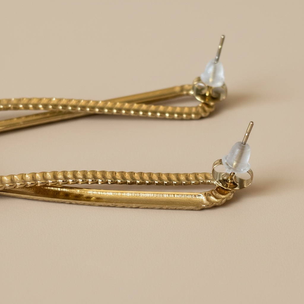 Pendientes nudo acero dorado