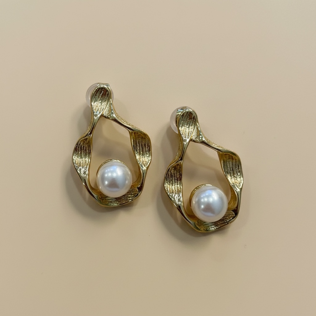Pendientes perla acero dorado