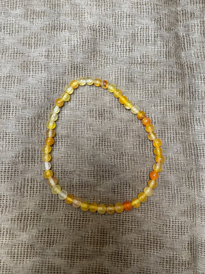 Pulsera bolas elástica amarilla